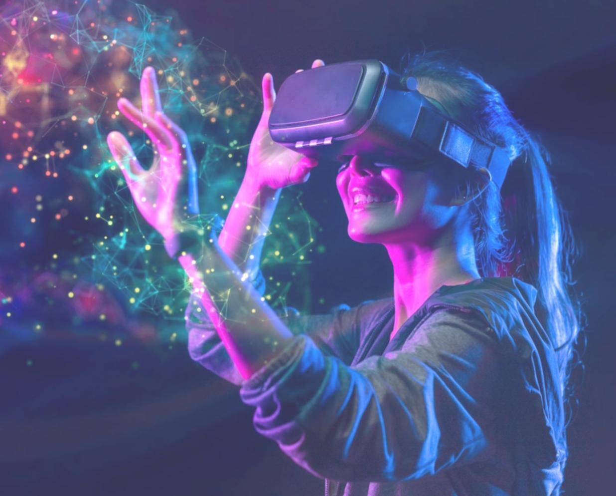 Student working on VR development project with headset and workstation